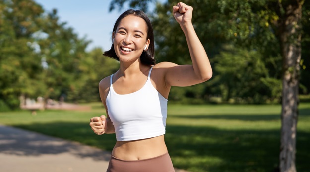 A healthy happy woman feeling good because she doesn't suffer from urinary difficulties anymore.
